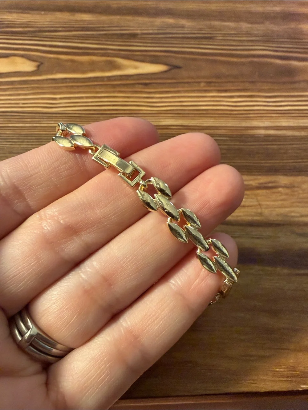 Gold-Tone Bracelet with Red Gem Leaf Accents